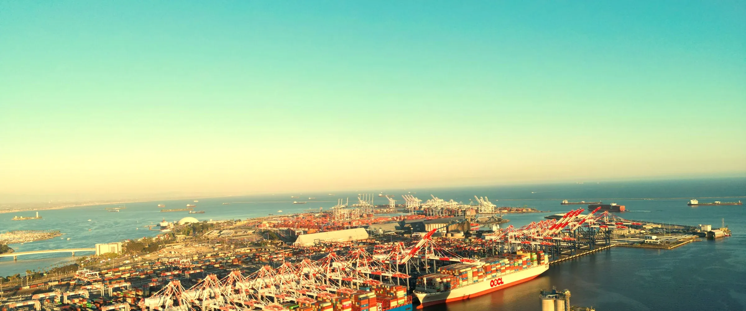 Aerial view of a container ship and cargo terminal, symbolising Vietnam’s trade-driven FDI growth